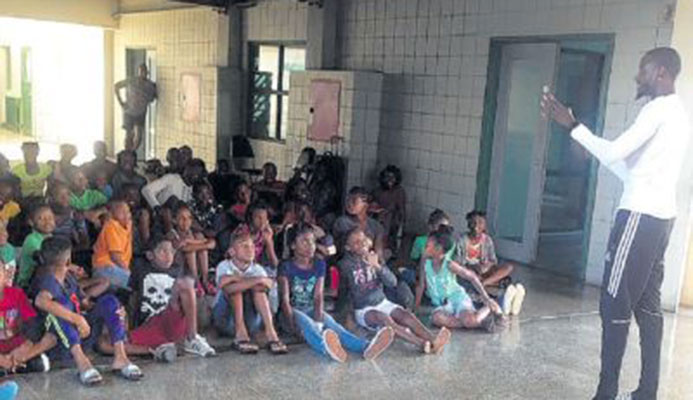 T&T’s World Championship gold medallist in the men’s 4x400 metres relay and silver medallist in the men’s 200m, Jereem Richards, right, interacts with members of the Cougars Track and field club at their training camp at the Mannie Ramjohn Stadium, Marabella on Friday. T&T’s World Championship gold medallist in the men’s 4x400 metres relay and silver medallist in the men’s 200m, Jereem Richards, right, interacts with members of the Cougars Track and field club at their training camp at the Mannie Ramjohn Stadium, Marabella on Friday.