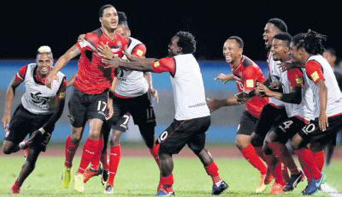 Trinidad and Tobago’s Alvin Jones (17) celebrates with teammates after scoring against United States in their final round Concacaf Zone World Cup qualifier at the Ato Boldon Stadium, Couva, last night. T&T won 2-1 to end the USA’s hopes of reaching Russia. PICTURE AP Trinidad and Tobago’s Alvin Jones (17) celebrates with teammates after scoring against United States in their final round Concacaf Zone World Cup qualifier at the Ato Boldon Stadium, Couva, last night. T&T won 2-1 to end the USA’s hopes of reaching Russia. PICTURE AP