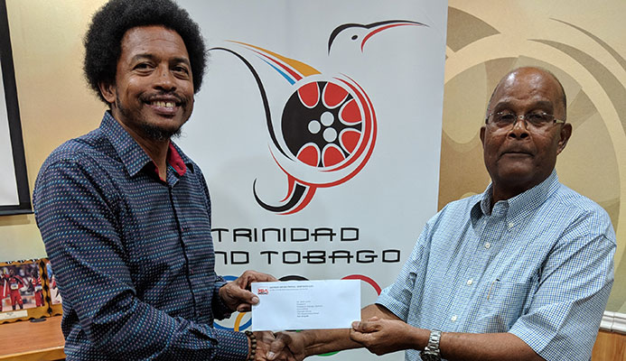 TTOC’s President, Brian Lewis receiving the cheque from Kenneth Ferguson of the KENSON TTOC’s President, Brian Lewis receiving the cheque from Kenneth Ferguson of the KENSON