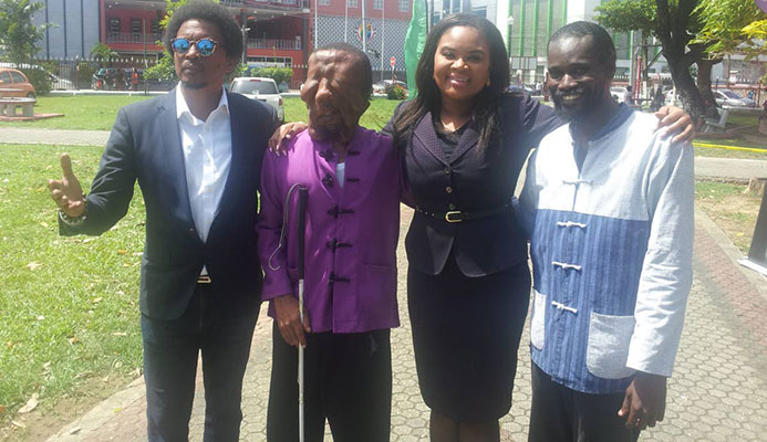 Visually impaired martial arts athlete Shawn Sealy of Barbados, second from left, at the Olympic Day celebrations at Woodford Square, on Friday. Also in the photo are president of the TT Olympic Committee Brian Lewis, left, Minister of Sport and Youth Affairs Shamfa Cudjoe, second from right, and Sealy’s coach Erskine Husbands. Visually impaired martial arts athlete Shawn Sealy of Barbados, second from left, at the Olympic Day celebrations at Woodford Square, on Friday. Also in the photo are president of the TT Olympic Committee Brian Lewis, left, Minister of Sport and Youth Affairs Shamfa Cudjoe, second from right, and Sealy’s coach Erskine Husbands.