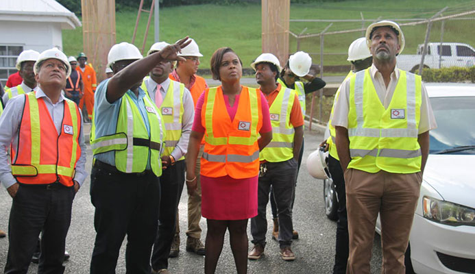 Project Manager Mc Jasse Salino points to the ongoing works at the Dwight Yorke Stadium, as Minister of Sport and Youth Affairs Shamfa Cudjoe (centre) and officials from THA, SPORTT and UDECOTT tour the facility on Tuesday. Project Manager Mc Jasse Salino points to the ongoing works at the Dwight Yorke Stadium, as Minister of Sport and Youth Affairs Shamfa Cudjoe (centre) and officials from THA, SPORTT and UDECOTT tour the facility on Tuesday.