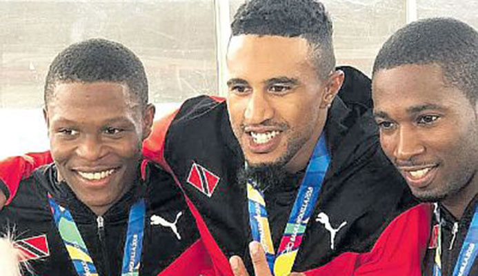 T&T men’s cycling sprint team from left, Nicholas Paul, Njisane Phillip and Kwesi Browne sporting their gold medals won during yesterday’s sprint event. T&T men’s cycling sprint team from left, Nicholas Paul, Njisane Phillip and Kwesi Browne sporting their gold medals won during yesterday’s sprint event.