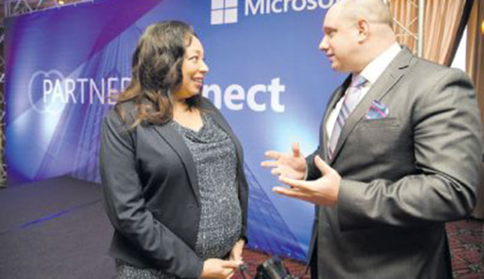 Racquel Moses, country manager, Microsoft T&T, and Herbert Lewy, general manager, Microsoft Caribbean, speak during the Microsoft Trinidad and Tobago Partner Connect at the MovieTowne Banquet and Conference Centre Port-of-Spain yesterday. PICTURE ANISTO ALVES Racquel Moses, country manager, Microsoft T&T, and Herbert Lewy, general manager, Microsoft Caribbean, speak during the Microsoft Trinidad and Tobago Partner Connect at the MovieTowne Banquet and Conference Centre Port-of-Spain yesterday. PICTURE ANISTO ALVES