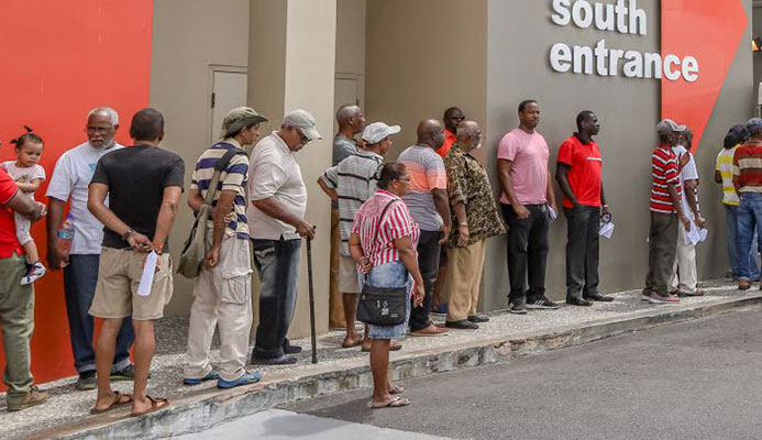 Members of the public wait in long lines to enter the Health Ministry's Men's Wellness Initiative Clinic at the Colposcopy Centre in the Mt Hope Women's Hospital yesterday. Members of the public wait in long lines to enter the Health Ministry's Men's Wellness Initiative Clinic at the Colposcopy Centre in the Mt Hope Women's Hospital yesterday.
