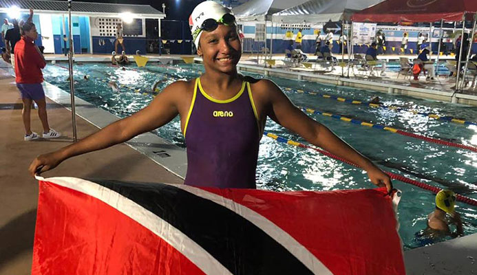 Jada Chatoor holding up the TT flag at the Carifta Championships in Barbados. PHOTO BY SHERDON PIERRE Jada Chatoor holding up the TT flag at the Carifta Championships in Barbados. PHOTO BY SHERDON PIERRE