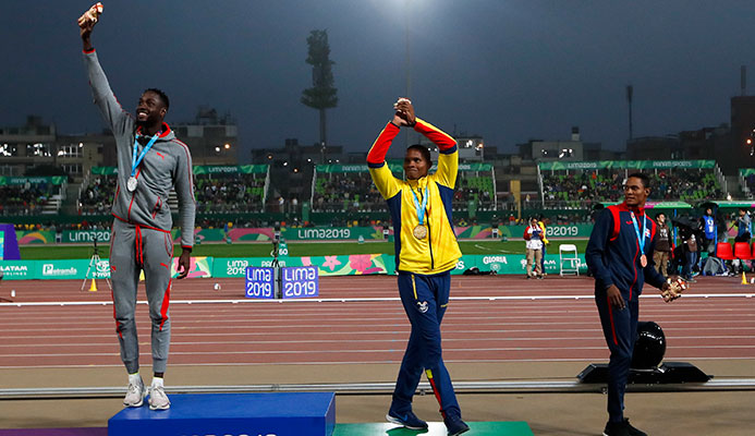 Silver medalist Jereem Richards of Trinidad and Tobago, right, walks away as gold medalist Alex Quinonez of Ecuador, center, and bronze medalist Yancarlos Martinez of Dominican Republic celebrate on the podium for the men's 200m during the athletics at the Pan American Games in Lima, Peru, Friday, Aug. 9, 2019. (AP Photo/Moises Castillo) Silver medalist Jereem Richards of Trinidad and Tobago, right, walks away as gold medalist Alex Quinonez of Ecuador, center, and bronze medalist Yancarlos Martinez of Dominican Republic celebrate on the podium for the men's 200m during the athletics at the Pan American Games in Lima, Peru, Friday, Aug. 9, 2019. (AP Photo/Moises Castillo)