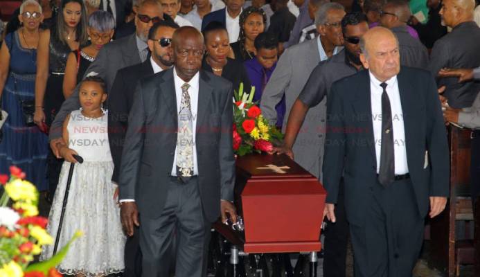 Friends of the late sports journalist Dave Lamy former Fifa vice president Jack Warner (L) and Joe Hadeed (R) carry his casket at the end of Lamy's funeral, at the Holy Trinity Cathedral, Port of Spain. - ROGER JACOB Friends of the late sports journalist Dave Lamy former Fifa vice president Jack Warner (L) and Joe Hadeed (R) carry his casket at the end of Lamy's funeral, at the Holy Trinity Cathedral, Port of Spain. - ROGER JACOB