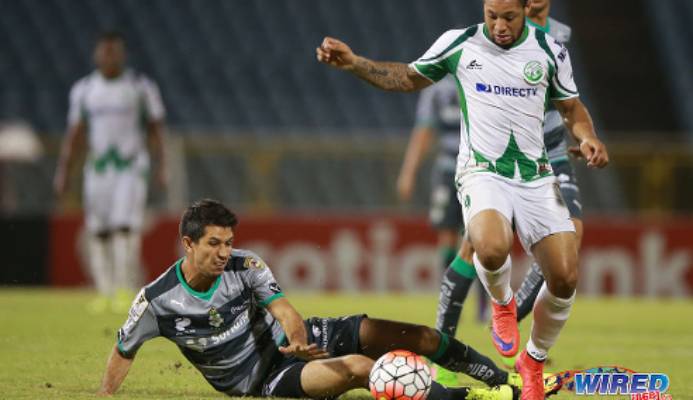 Photo: W Connection attacker Shahdon Winchester (right) evades a tackle from Santos Laguna defender Jesus Molina during 2015/16 CONCACAF Champions League action. (Courtesy Allan V Crane/Wired868) Photo: W Connection attacker Shahdon Winchester (right) evades a tackle from Santos Laguna defender Jesus Molina during 2015/16 CONCACAF Champions League action. (Courtesy Allan V Crane/Wired868)
