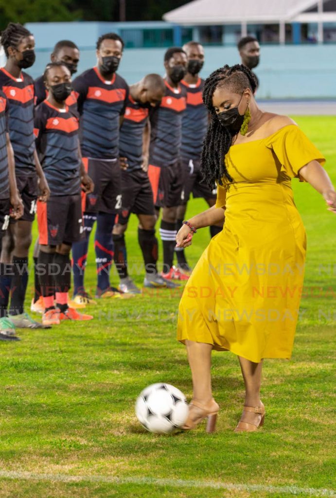 Sports Minister Shamfa Cudjoe kicks the ball ahead of an exhibition game between Bethel United FC and Canaan/1976 FC Phoenix at the newly reopened Dwight Yorke Stadium in Bacolet on Saturday. PHOTOS BY DAVID REID - Sports Minister Shamfa Cudjoe kicks the ball ahead of an exhibition game between Bethel United FC and Canaan/1976 FC Phoenix at the newly reopened Dwight Yorke Stadium in Bacolet on Saturday. PHOTOS BY DAVID REID -