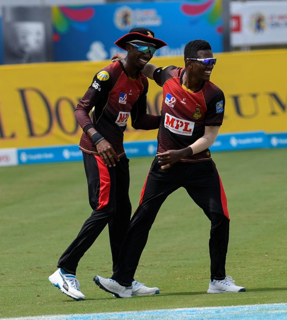 In this file Sep 2 file photo, Khary Pierre (left) and Akeal Hosein of Trinbago Knight Riders celebrate the dismissal of Alzarri Joseph of St Kitts/Nevis Patriots during the teams’ Hero Caribbean Premier League match 23 at the Brian Lara Cricket Academy, Tarouba. (Photo by CPL T20 via Getty Images) - In this file Sep 2 file photo, Khary Pierre (left) and Akeal Hosein of Trinbago Knight Riders celebrate the dismissal of Alzarri Joseph of St Kitts/Nevis Patriots during the teams’ Hero Caribbean Premier League match 23 at the Brian Lara Cricket Academy, Tarouba. (Photo by CPL T20 via Getty Images) -
