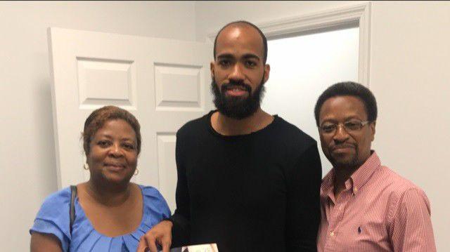 FAMILY TIME: Machel Cedenio, centre, poses for a photo with his proud parents, Diane, left, and Hayden. FAMILY TIME: Machel Cedenio, centre, poses for a photo with his proud parents, Diane, left, and Hayden.