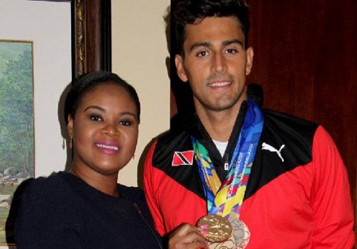 FLASHBACK: Shamfa Cudjoe, Minister of Sport and Community Development, left, and Dylan Carter at the VIP Lounge, Piarco International Airport in 2018. Minister Cudjoe holds one of the five medals earned by Carter at the 2018 CAC Games in Barranquilla, Colombia. FLASHBACK: Shamfa Cudjoe, Minister of Sport and Community Development, left, and Dylan Carter at the VIP Lounge, Piarco International Airport in 2018. Minister Cudjoe holds one of the five medals earned by Carter at the 2018 CAC Games in Barranquilla, Colombia.