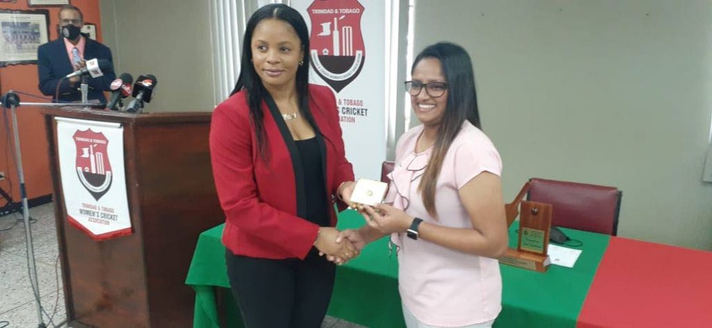 Merissa Aguilliera , left, presents Anisa Mohammed with a ring inscribed with Mohammed's initials and her playing kit number on behalf of the TT Women's Cricket Association, at theNational Cricket Centre, Couva, on Monday. - Photo courtesy TTWCA Merissa Aguilliera , left, presents Anisa Mohammed with a ring inscribed with Mohammed's initials and her playing kit number on behalf of the TT Women's Cricket Association, at theNational Cricket Centre, Couva, on Monday. - Photo courtesy TTWCA