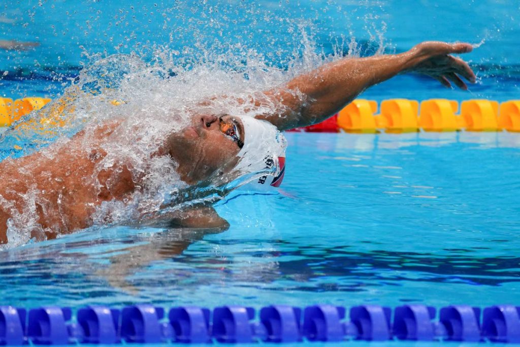 Dylan Carter, of Trinidad and Tobago, swims in a heat during the men's 100-metre backstroke at the 2020 Summer Olympics, on July 25, 2021, in Tokyo, Japan. (AP PHOTO) - AP Dylan Carter, of Trinidad and Tobago, swims in a heat during the men's 100-metre backstroke at the 2020 Summer Olympics, on July 25, 2021, in Tokyo, Japan. (AP PHOTO) - AP