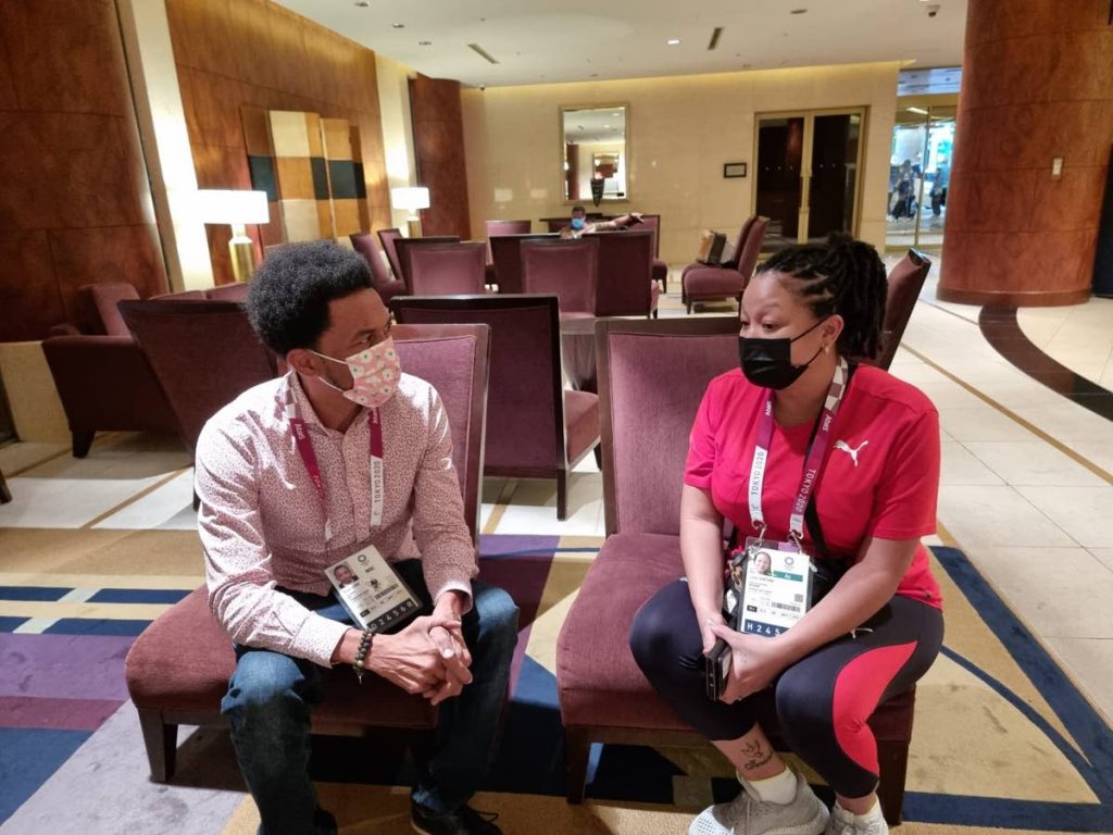 TTOC president Brian Lewis, left, in discussion with chef de mission Lovie Santana during the Olympic Games in Tokyo, Japan. - TTOC president Brian Lewis, left, in discussion with chef de mission Lovie Santana during the Olympic Games in Tokyo, Japan. -