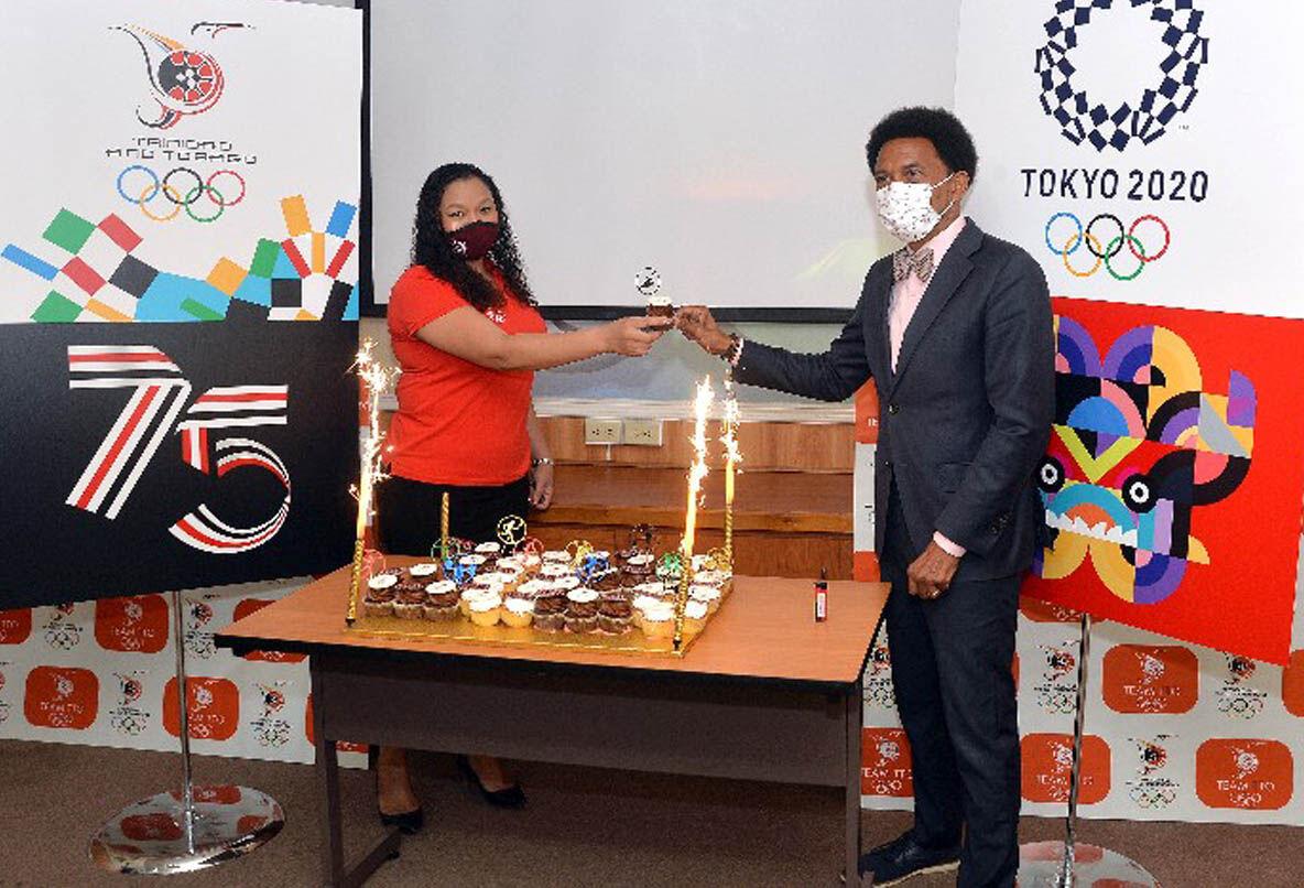 Trinidad and Tobago Olympic Committee (TTOC) president Brian Lewis, right, and Team TTO chef de mission for the July 23 - August 8 Tokyo Olympic Games, Lovie Santana, toast over some commemorative Team TTO cupcakes. —Photo: ROBERT TAYLOR Trinidad and Tobago Olympic Committee (TTOC) president Brian Lewis, right, and Team TTO chef de mission for the July 23 - August 8 Tokyo Olympic Games, Lovie Santana, toast over some commemorative Team TTO cupcakes. —Photo: ROBERT TAYLOR