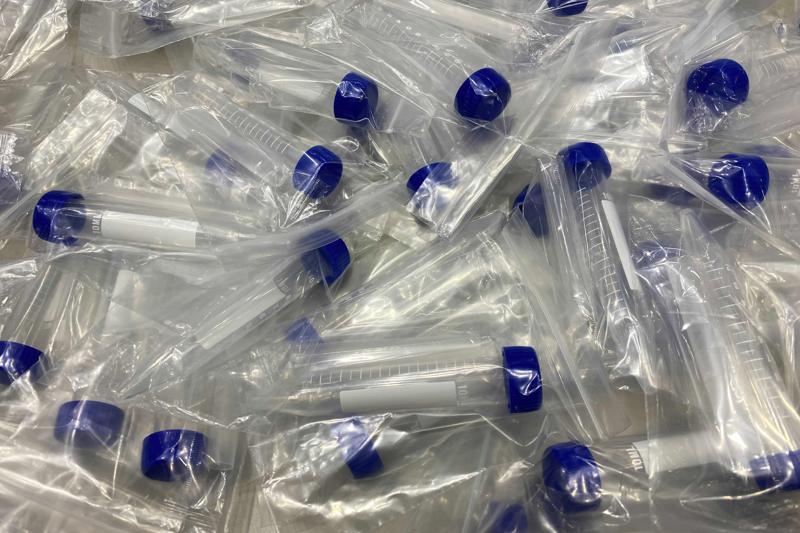 Plastic vials for testing the coronavirus infection sit on a table at the Main Press Center for the 2020 Summer Olympics, Friday, July 30, 2021, in Tokyo, Japan. About 30,000 people are spitting into tiny plastic vials every day at the Tokyo Olympics in a routine that’s grown crucial in going ahead with the pandemic-era Games. (AP Photo) Plastic vials for testing the coronavirus infection sit on a table at the Main Press Center for the 2020 Summer Olympics, Friday, July 30, 2021, in Tokyo, Japan. About 30,000 people are spitting into tiny plastic vials every day at the Tokyo Olympics in a routine that’s grown crucial in going ahead with the pandemic-era Games. (AP Photo)