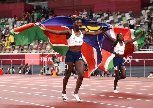 Namibia's Beatrice Masilingi, left, celebrates with teammate and silver-medal winner Christine Mboma after the women's 200m final at the Tokyo Olympics in Japan on Tuesday. (Ryan Pierse/Getty Images) Namibia's Beatrice Masilingi, left, celebrates with teammate and silver-medal winner Christine Mboma after the women's 200m final at the Tokyo Olympics in Japan on Tuesday. (Ryan Pierse/Getty Images)