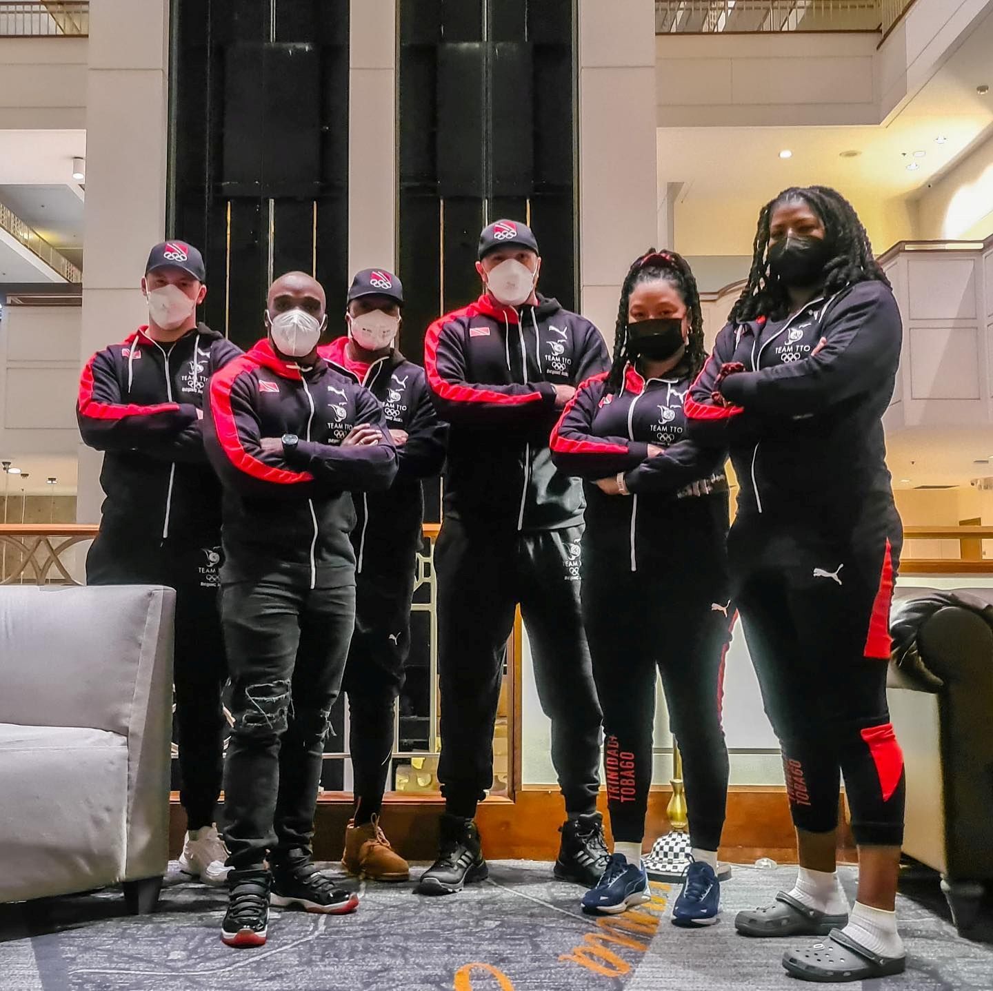 COVID-19 Liaison Officer Rheeza Grant, from right, Team TTO Chef de Mission Lovie Santana, Axel Browne, Andre Marcano, and technical support Thomas Harris are en route to Beijing, China met with Mikel Thomas, second from left, in Atlanta and will now make their way to Istanbul then Beijing. COVID-19 Liaison Officer Rheeza Grant, from right, Team TTO Chef de Mission Lovie Santana, Axel Browne, Andre Marcano, and technical support Thomas Harris are en route to Beijing, China met with Mikel Thomas, second from left, in Atlanta and will now make their way to Istanbul then Beijing.