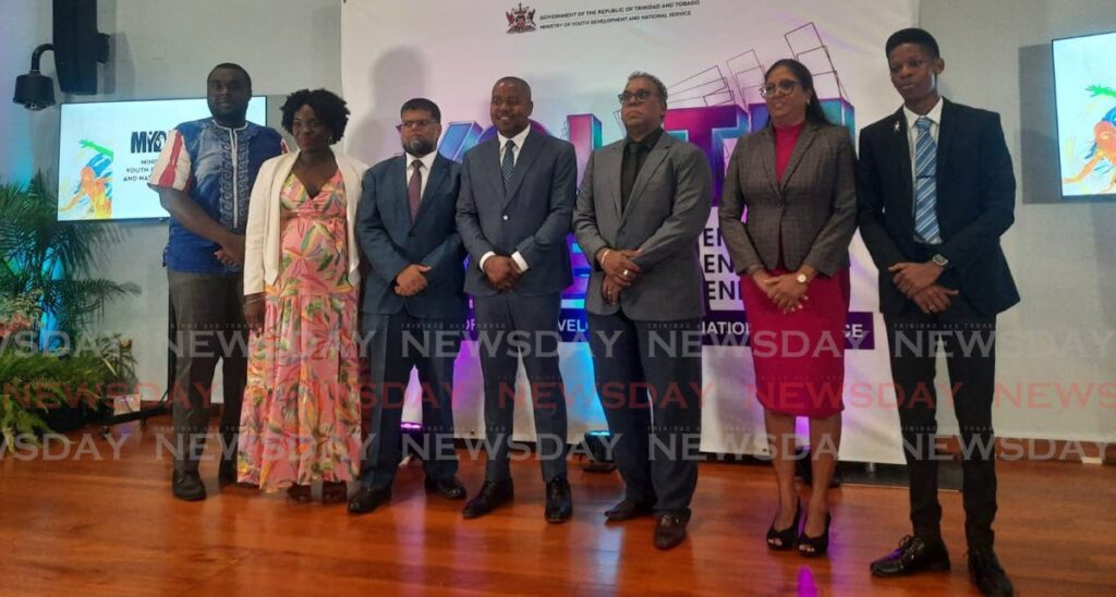 Minister of Youth Development and National Service Foster Cummings, centre, with ministry officials and and youth worker conference facilitators at the ministry's launch of its Youth Week activities at the UWI's Teaching and Learning Centre, St Augustine, on Tuesday. - PAULA LINDO (Image obtained at newsday.co.tt) Minister of Youth Development and National Service Foster Cummings, centre, with ministry officials and and youth worker conference facilitators at the ministry's launch of its Youth Week activities at the UWI's Teaching and Learning Centre, St Augustine, on Tuesday. - PAULA LINDO (Image obtained at newsday.co.tt)