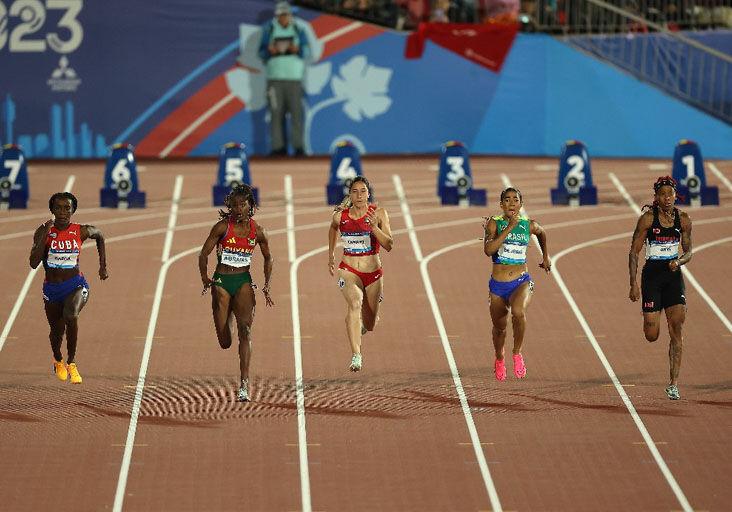 DASH ON: Team TTO’s Michelle-Lee Ahye, right, gets into her stride during the women’s 100 metres final, at the Estadio Nacional, during the Pan American Games in Santiago, Chile, last night. Ahye copped bronze behind gold medallist, Cuba’s Yunisleidy García, left, and Guyana’s Jasmine Abrams, second from left, who secured silver. T&T’s other competitor in the final, Reyare Thomas, finished sixth. —Photo courtesy Photosport/Panam Sports (Image obtained at trinidadexpress.com) DASH ON: Team TTO’s Michelle-Lee Ahye, right, gets into her stride during the women’s 100 metres final, at the Estadio Nacional, during the Pan American Games in Santiago, Chile, last night. Ahye copped bronze behind gold medallist, Cuba’s Yunisleidy García, left, and Guyana’s Jasmine Abrams, second from left, who secured silver. T&T’s other competitor in the final, Reyare Thomas, finished sixth. —Photo courtesy Photosport/Panam Sports (Image obtained at trinidadexpress.com)