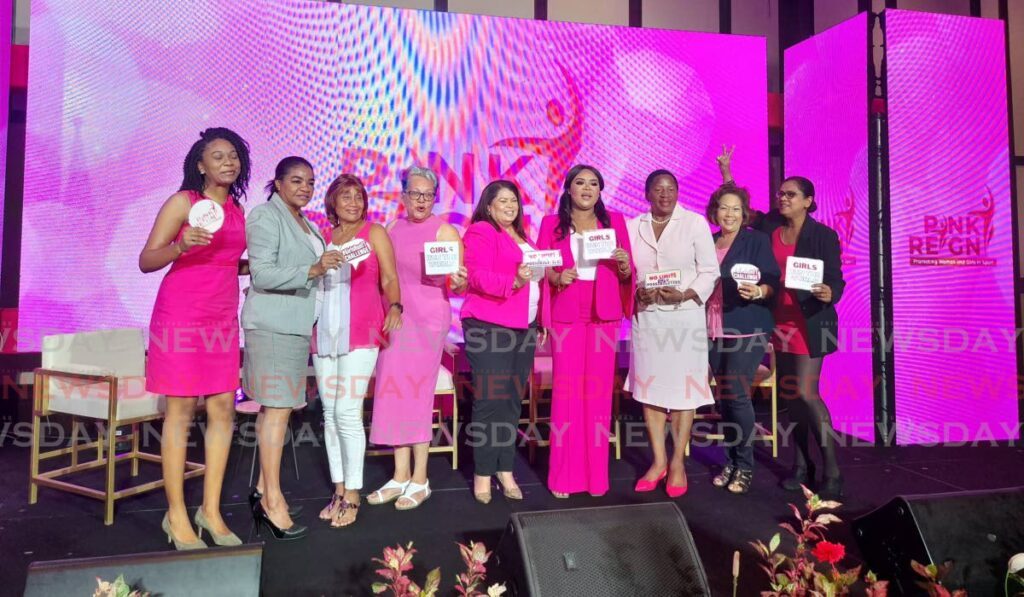 Minister of Sport and Community Development, Shamfa Cudjoe-Lewis (fourth from right) and Minister of Planning and Development, Penelope Beckles (third from right), with Team Poon members at the launch of Pink Reign 2024 at the Hilton Trinidad and Conference Centre on Wednesday. - Roneil Walcott (Image obtained at newsday.co.tt) Minister of Sport and Community Development, Shamfa Cudjoe-Lewis (fourth from right) and Minister of Planning and Development, Penelope Beckles (third from right), with Team Poon members at the launch of Pink Reign 2024 at the Hilton Trinidad and Conference Centre on Wednesday. - Roneil Walcott (Image obtained at newsday.co.tt)