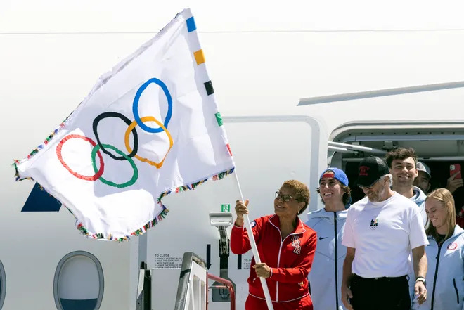 Los Angeles mayor Karen Bass waves the Olympic flag next to LA28 chairman Casey Wasserman after their plane landed during the event celebrating the arrival of the Olympic flag at Los Angeles International Airport (LAX) on Aug. 12. ETIENNE LAURENT, AFP Via Getty Images (Image obtained at usatoday.com) Los Angeles mayor Karen Bass waves the Olympic flag next to LA28 chairman Casey Wasserman after their plane landed during the event celebrating the arrival of the Olympic flag at Los Angeles International Airport (LAX) on Aug. 12. ETIENNE LAURENT, AFP Via Getty Images (Image obtained at usatoday.com)