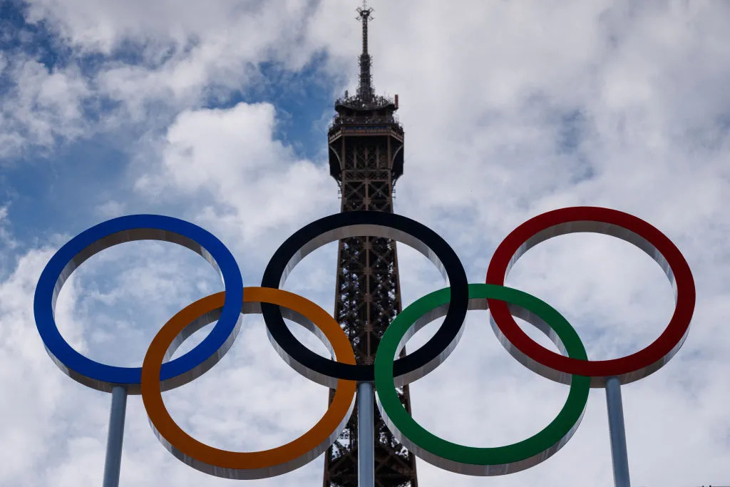 This photograph shows the Olympic Rings displayed at the construction site of the Eiffel Tower Stadium for the upcoming Paris 2024 Olympics and Paralympic Games which will host the Beach Volleyball and men's Blind Football competitions, at the Champ-De-Mars in Paris on July 10, 2024. DIMITAR DILKOFF/AFP— Getty Images (Image obtained at time.com) This photograph shows the Olympic Rings displayed at the construction site of the Eiffel Tower Stadium for the upcoming Paris 2024 Olympics and Paralympic Games which will host the Beach Volleyball and men's Blind Football competitions, at the Champ-De-Mars in Paris on July 10, 2024. DIMITAR DILKOFF/AFP— Getty Images (Image obtained at time.com)