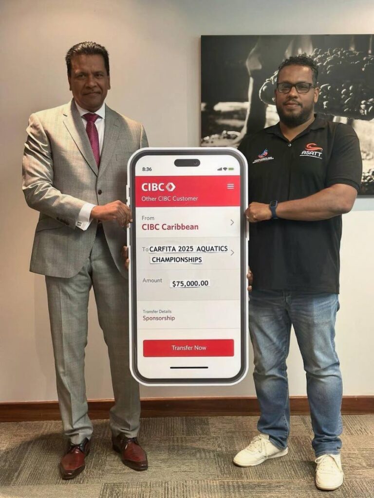 Anthony Seeraj, managing director of Trinidad Operations, CIBC Caribbean, left, presents, Aquatics Sports Association of TT president Shawn Pouchet with a cheque. - (Image obtained at newsday.co.tt)