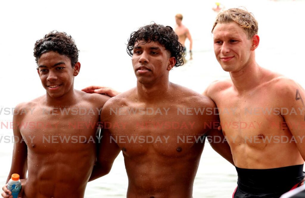 Zachary Anthony, centre, won the Carifta open water 5K males 16-18 race at Chagville Beach, Chaguaramas on April 23. Dominic Hilton of Cayman Islands, right, placed second while Martinique’s Nicolas Anais-Thiery, left, was third. - Photo by Faith Ayoung (Image obtained at newsday.co.tt) Zachary Anthony, centre, won the Carifta open water 5K males 16-18 race at Chagville Beach, Chaguaramas on April 23. Dominic Hilton of Cayman Islands, right, placed second while Martinique’s Nicolas Anais-Thiery, left, was third. - Photo by Faith Ayoung (Image obtained at newsday.co.tt)