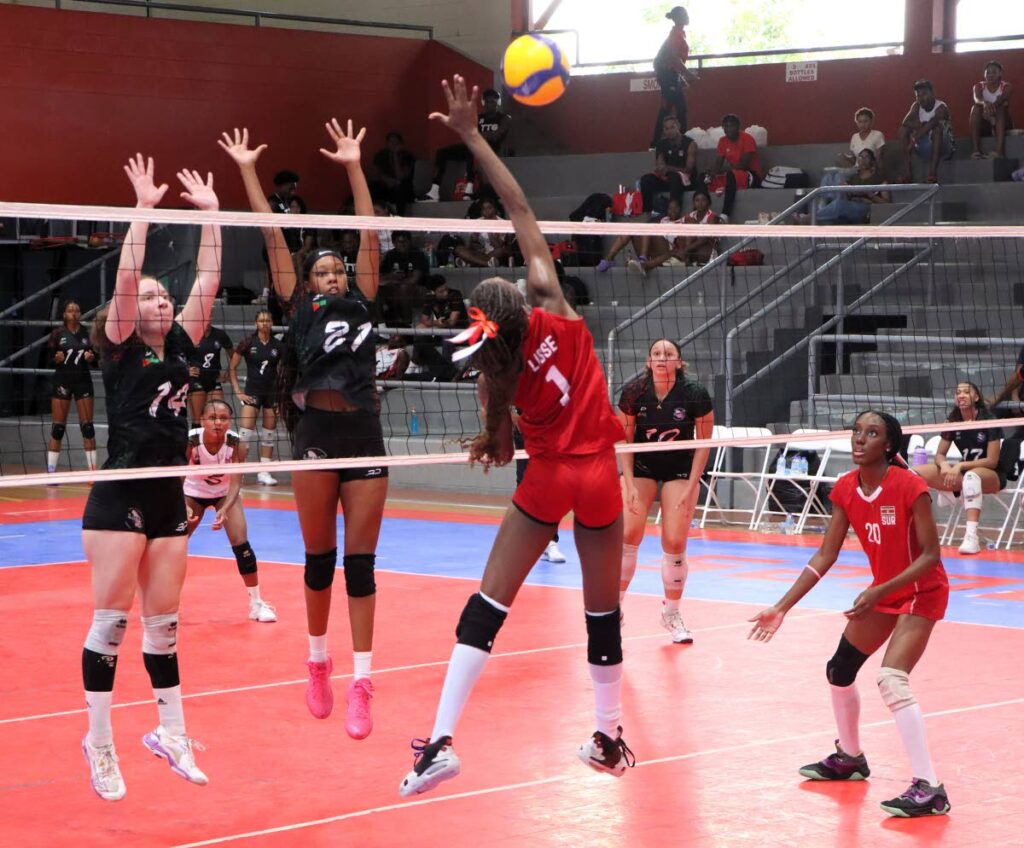 A Suriname player goes for a spike in their game against Martinique at the Caribbean Zonal Volleyball Championship at the Maloney Regional Complex, on July 13. - Photo by Angelo Marcelle (Image obtained at newsday.co.tt) A Suriname player goes for a spike in their game against Martinique at the Caribbean Zonal Volleyball Championship at the Maloney Regional Complex, on July 13. - Photo by Angelo Marcelle (Image obtained at newsday.co.tt)