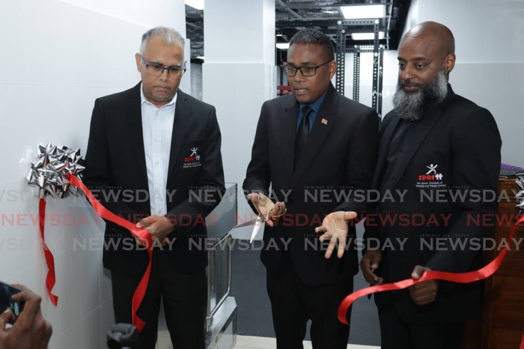 Phillip Watts, Minister of Sport and Youth Affairs, middle, cuts the ribbon at the opening of the new Elite Athlete Gym at the National Racquet Centre in Tacarigua, on August 25. Alongside Watts is SporTT CEO Jason Williams, left, and Tobias Ottley, head of the Elite Athlete Wellbeing Unit. - Photo by Grevic Alvarado (Image obtained at newsday.co.tt)
