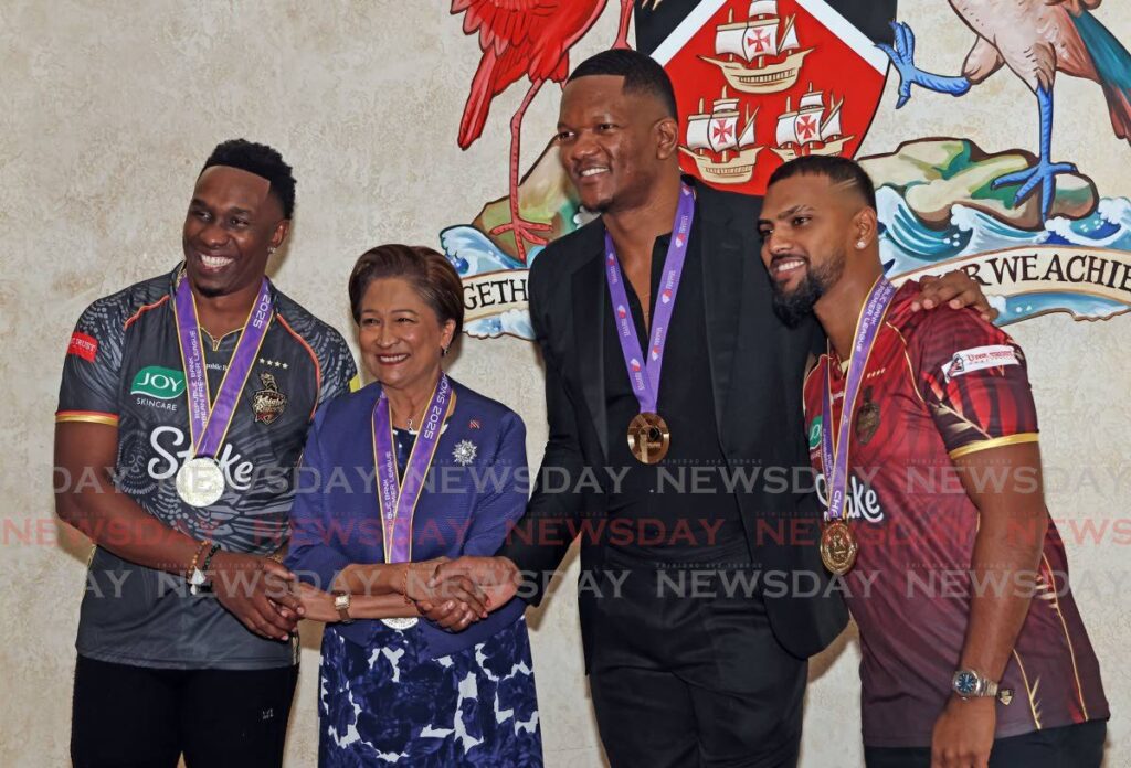 Prime Minister Kamla Persad-Bissessar congratulates Trinbago Knight Riders’ (TKR) coach Dwayne Bravo (L), javelin star and World Athletics Championship gold medallist Keshorn Walcott (2R) and TKR captain Nicholas Pooran, on September 23, at the Diplomatic Centre, St Ann’s. - Photo by Lincoln Holder (Image obtained at newsday.co.tt) Prime Minister Kamla Persad-Bissessar congratulates Trinbago Knight Riders’ (TKR) coach Dwayne Bravo (L), javelin star and World Athletics Championship gold medallist Keshorn Walcott (2R) and TKR captain Nicholas Pooran, on September 23, at the Diplomatic Centre, St Ann’s. - Photo by Lincoln Holder (Image obtained at newsday.co.tt)
