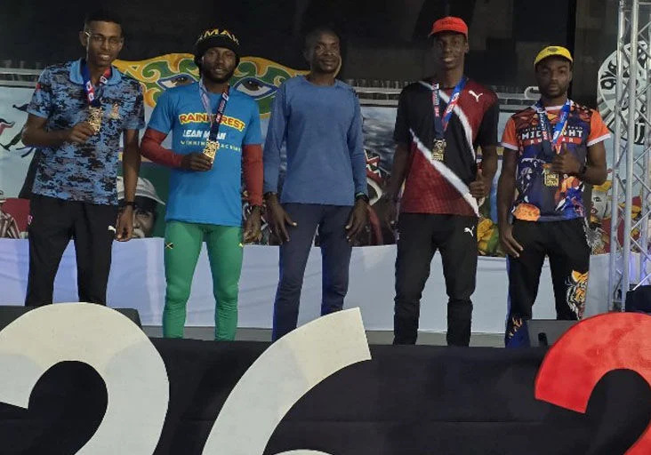 TOP 5: T&T Midnight Marathon champion Alex Ekesa, of Kenya, centre, is flanked by Keron Ali (3rd), far left, Jamaican Kemar Leslie (4th),  Christopher Mitchell (2nd) and Guyana’s Mmetue Neter (5th) at the Grand Stand, Queen’s Park  Savannah, in Port of Spain, yesterday. Ekesa won in 2:28:46. —Photo courtesy Verne Extavour (Image obtained at trinidadexpress.com)
