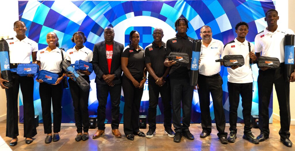 Representatives from the Trinidad and Tobago Carifta athletics team with Scott Franco, head of Shared Services & Special Projects, The Brydens Group, third from right, following the handover of Brydens’ donation to the team. - (Image obtained at newsday.co.tt)