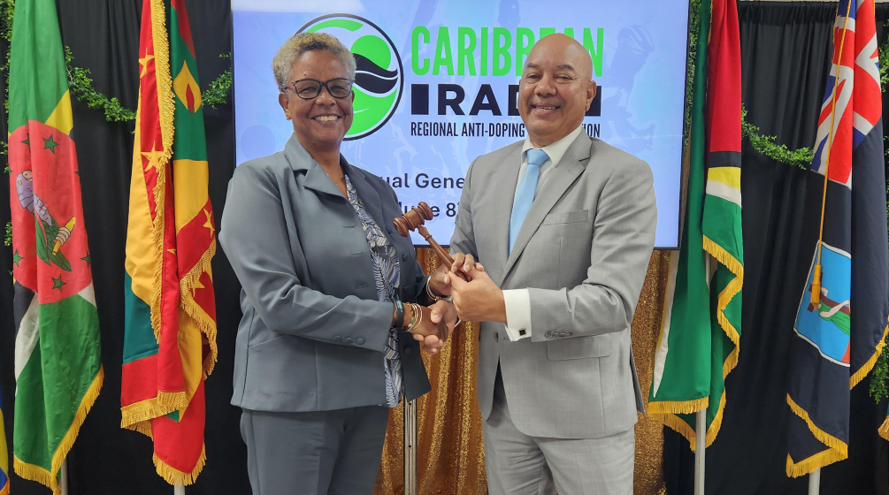 Outgoing Chair Patrick Werleman (Aruba) passing the gavel to new Chair Dr. Karen Pilgrim (Guyana) (Image obtained from Caribbean RADO Press Release)