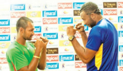 FIGHTING STANCE: Guyana Amazon Warriors skipper Denesh Ramdin, left, and Barbados Tridents captain Kieron Pollard share a light moment ahead of today’s Limacol Caribbean Premier League final which bowls off at 4 p.m. at Warner Park in St Kitts. --Photo: CPLT20