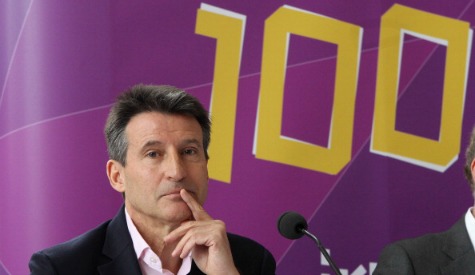 Sebastian Coe in front of 100 days to go sign