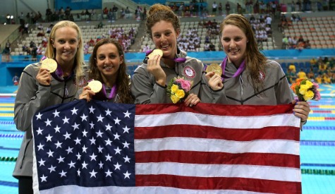 The US women proudly display their gold medals after the 4x100 metres medley relay