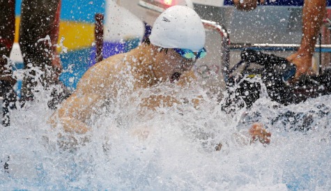 Sun Yang celebrates after taking the 1500 metres gold in a world record time